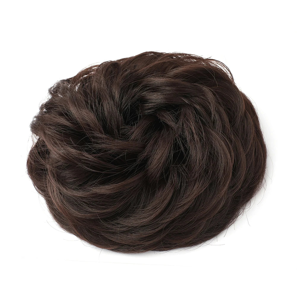 A dark brown messy bun hairstyle for curly updos.
