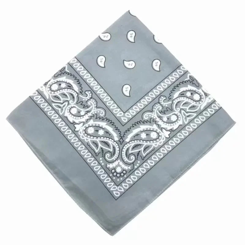 A gray cotton bandana scarf featuring white paisley and geometric patterns.