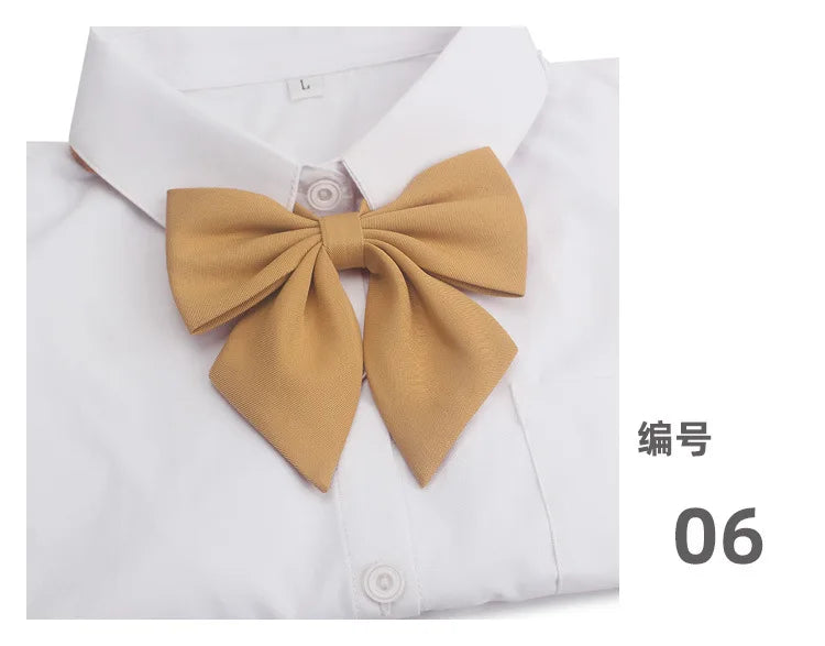 White dress shirt with a tan bow tie and a size label