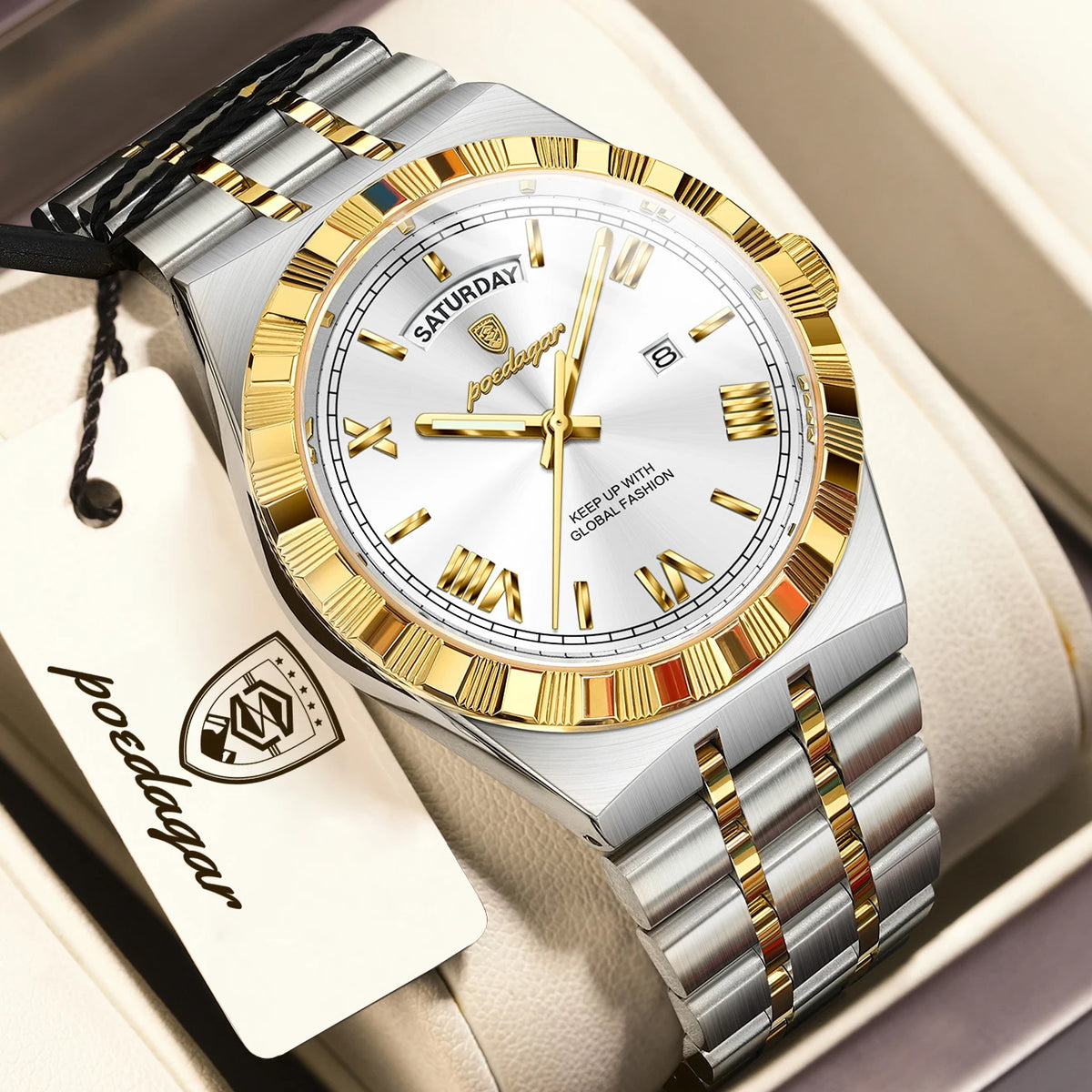 A silver and gold men's luminous quartz wristwatch with a leather strap is displayed in a box.