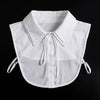 White blouse with a false collar and detachable neckline, shown flat lay.