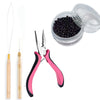 A set of nano copper hair extensions tools including tweezers and a clear container of black beads.