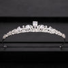 A delicate silver bridal crown adorned with clear crystals and diamonds.