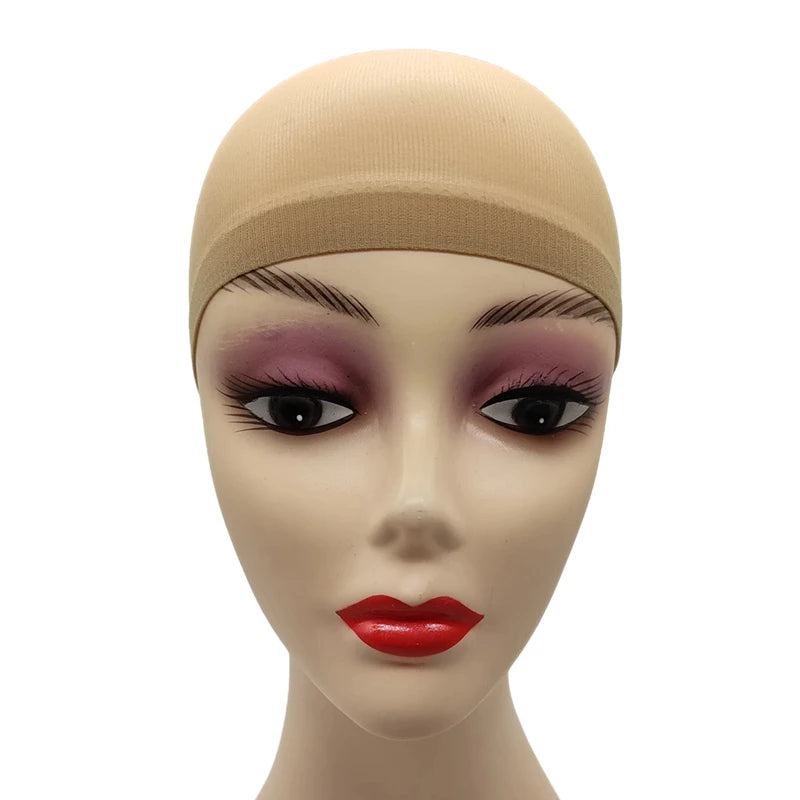 A mannequin head wearing a beige stretch mesh wig net cap with dramatic purple eyeshadow and red lipstick.