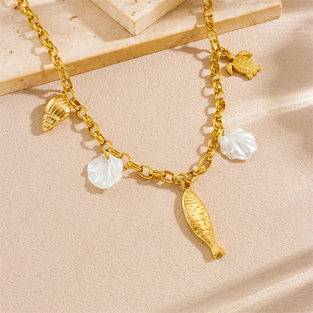 Gold-toned stainless steel starfish heart pendant necklace with white pearl accents