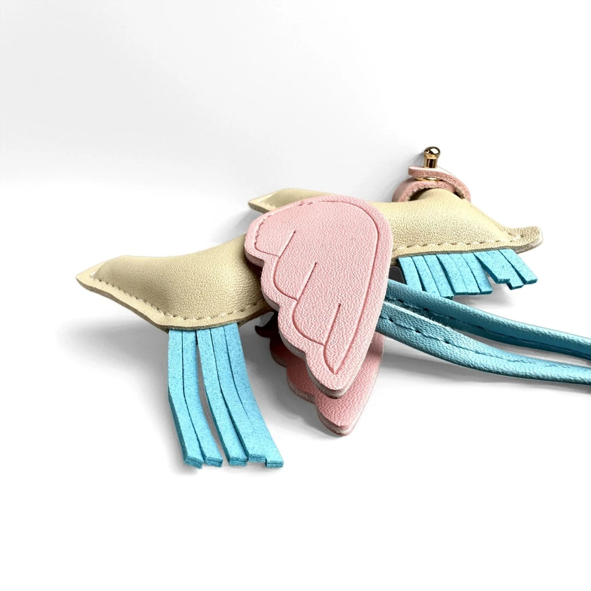 A set of elegant winged pony keychains featuring pink and blue feather accents.