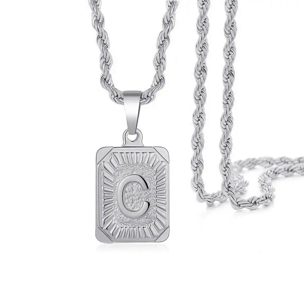 A silver letter pendant necklace featuring the letter C suspended from a delicate chain.