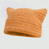 A knitted orange crocheted cat ears beanie hat