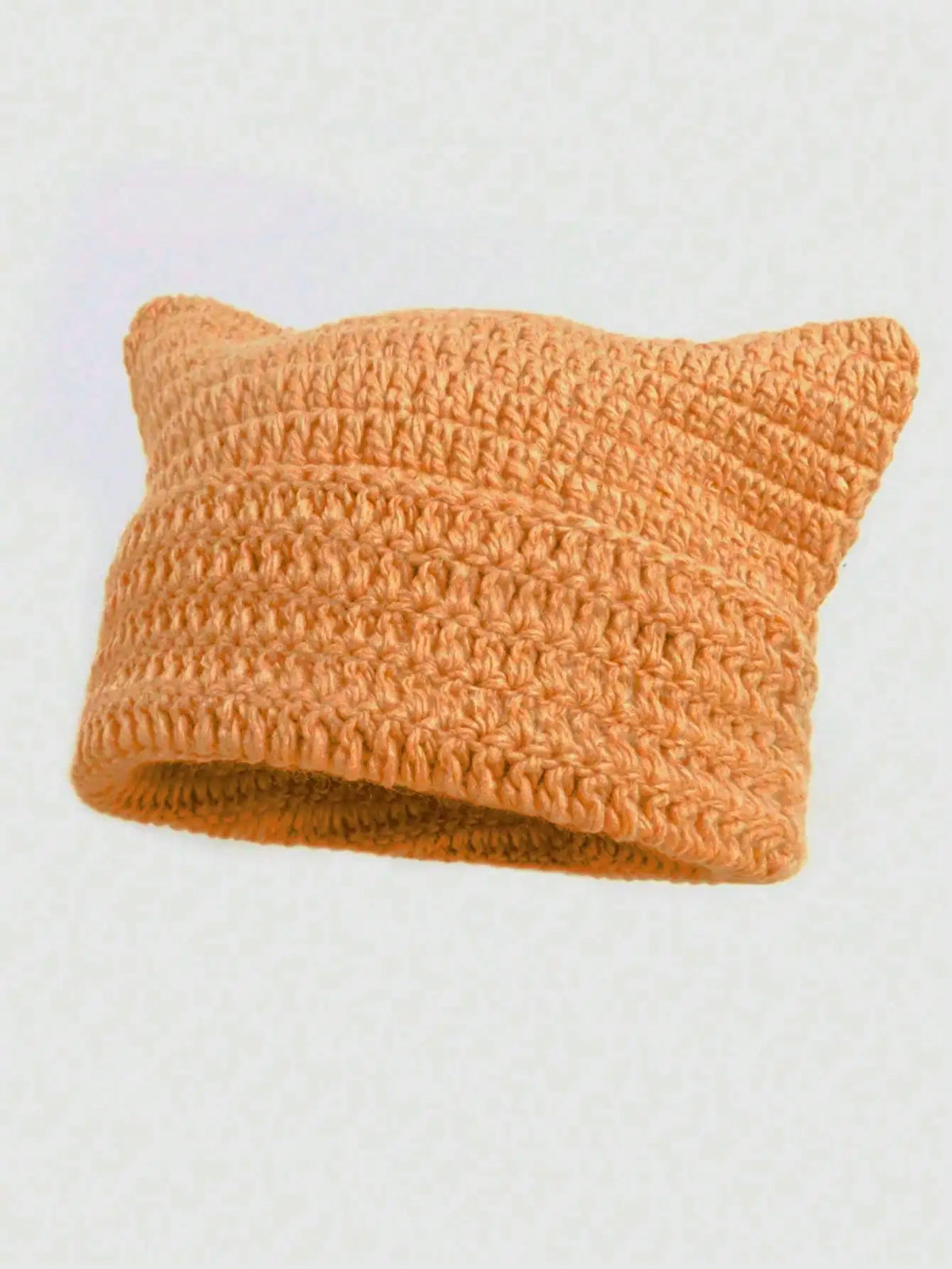 A knitted orange crocheted cat ears beanie hat