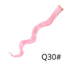 A long, pink, wavy synthetic hair extension is shown extending diagonally across the frame.