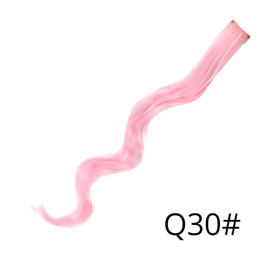 A long, pink, wavy synthetic hair extension is shown extending diagonally across the frame.