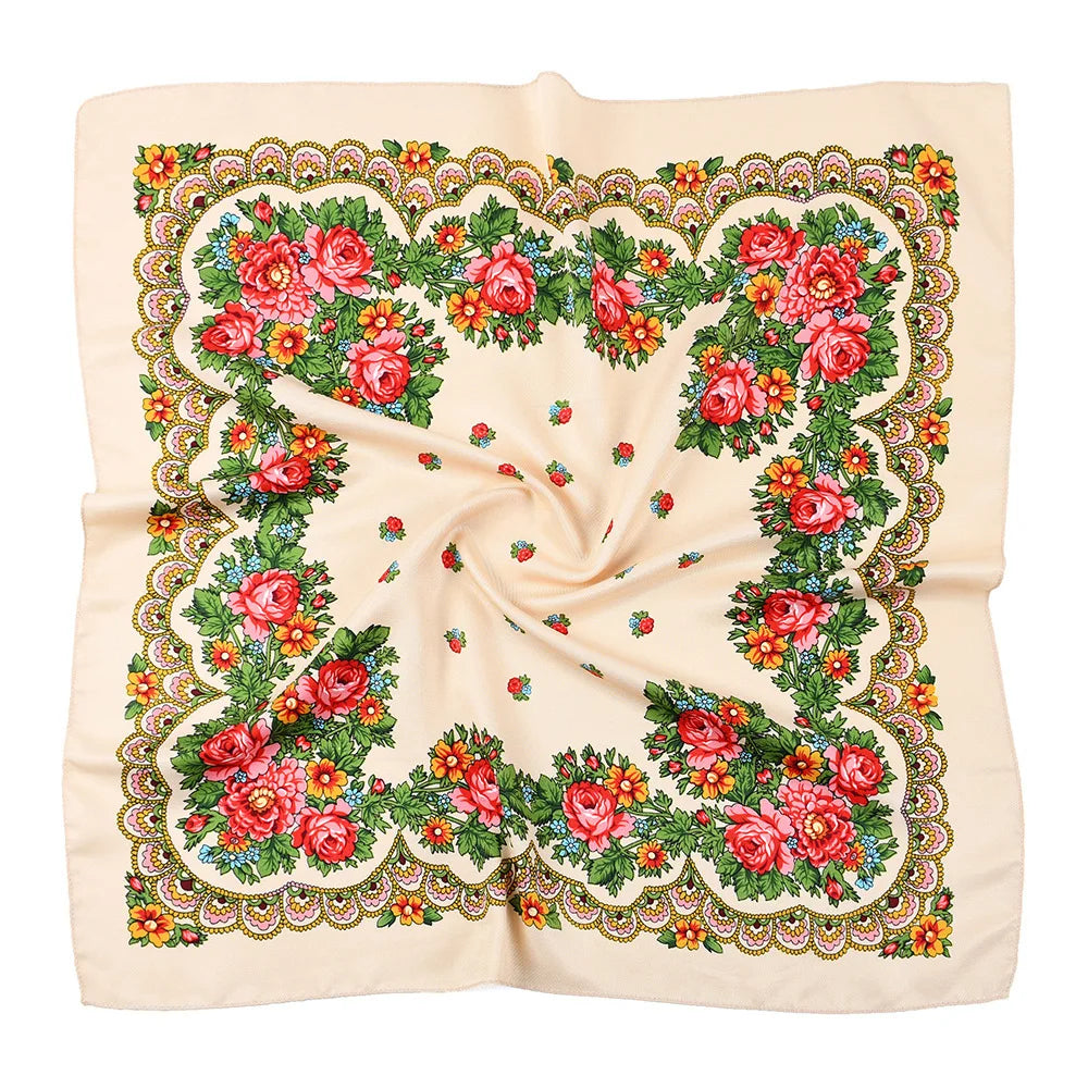 A cream-colored square scarf featuring a detailed floral print with roses and greenery.