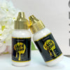 Eine Flasche Luxfume Lace Klebstoffgel für wasserfeste Perückenkleber neben einer weißen Blume.