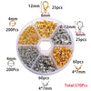 A plastic container holding various gold and silver jewelry findings including clasps, hooks, and jump rings.