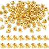 A collection of gold-colored jewelry findings stoppers and spacers for connectors.