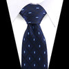 A dark blue silk necktie with a subtle patterned texture and light blue accents, shown against a white shirt.