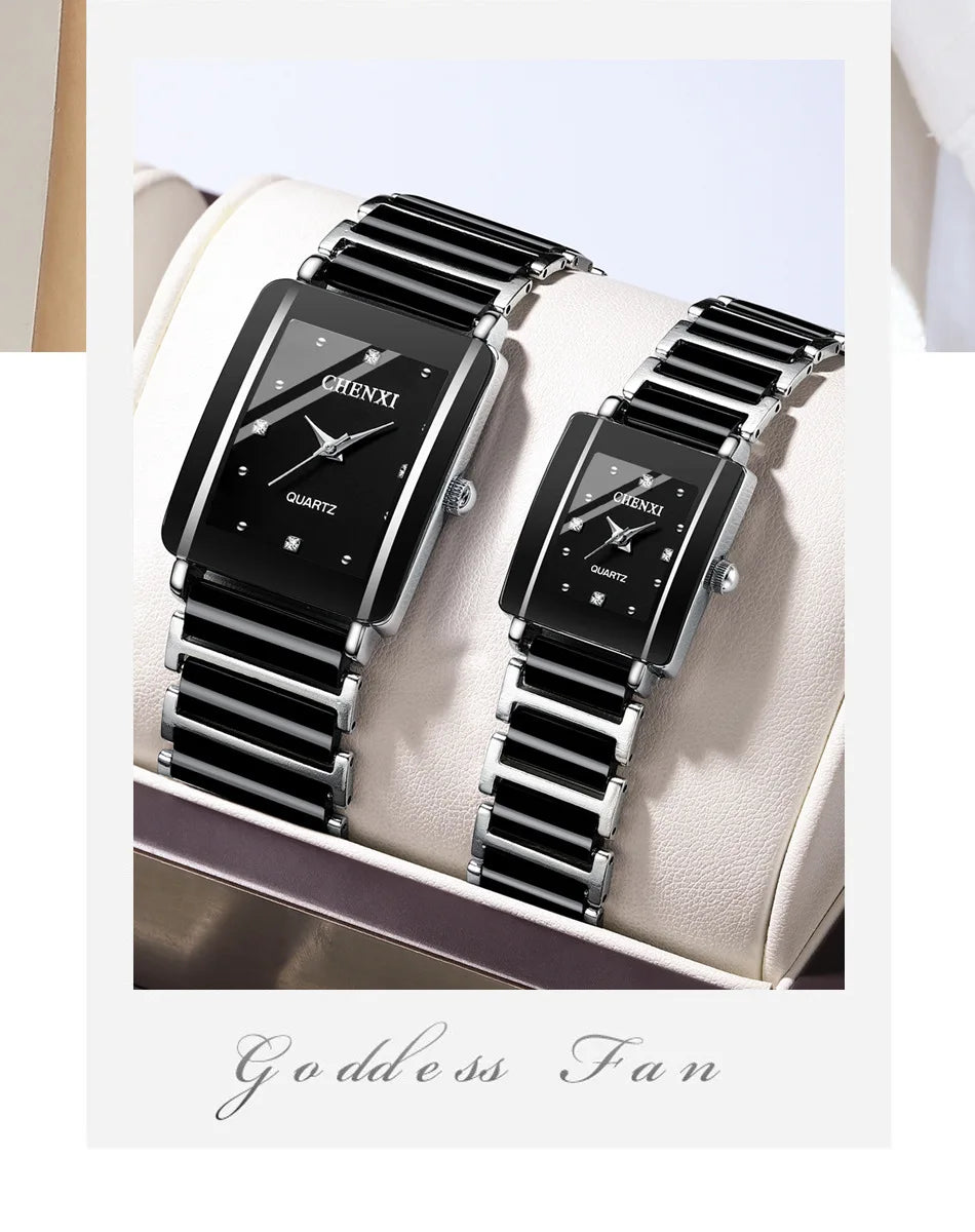 A pair of black luxury quartz watches with silver accents displayed on a light-colored surface.