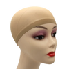 A mannequin head wearing a beige stretch mesh wig net cap with dark makeup and red lips.