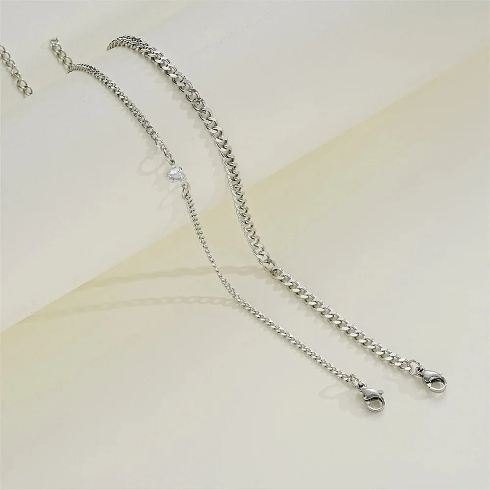 A set of dainty stainless steel heart link bracelets for couples displayed on a light background.
