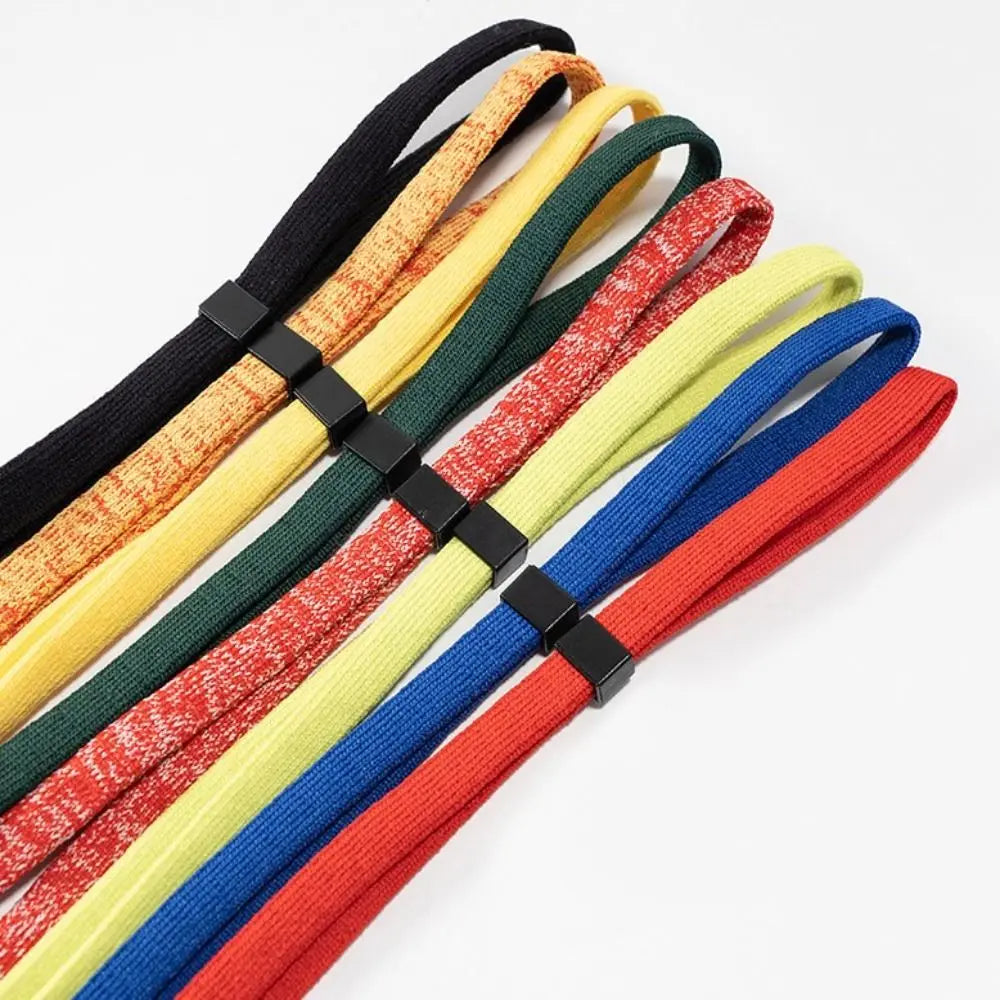 A collection of colorful adjustable eyewear lanyards or necklaces arranged diagonally.