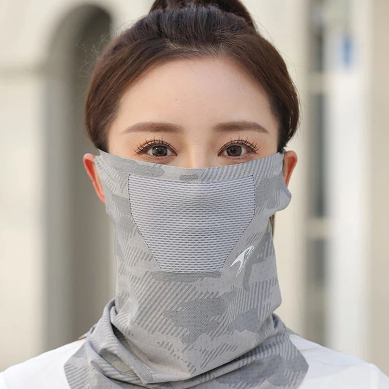 A woman wearing a gray camouflage ice silk breathable face and neck gaiter covering her lower face and neck.