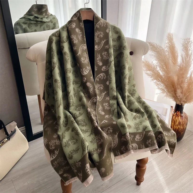 A draped olive green and brown plaid cashmere scarf wrapped around a white chair.