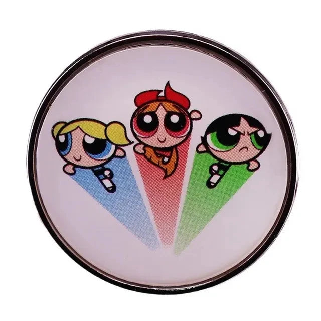 A round lapel pin featuring a cartoon character with pink hair and large eyes set against a light background.