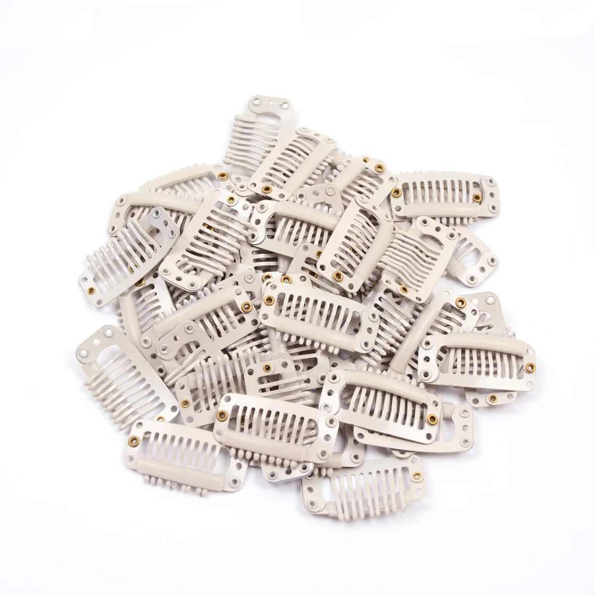A pile of light beige hair extension snap clips for wigs.