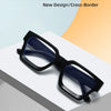 A pair of black square anti-blue light computer glasses with blue lenses resting on a white surface.