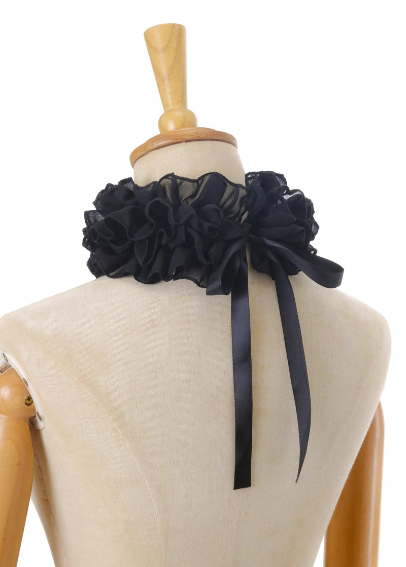 Black decorative pleated ruffle stand collar sweater tied with a black ribbon displayed on a mannequin.