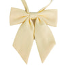 A light yellow butterfly ribbon tie set with a bow and two tails.