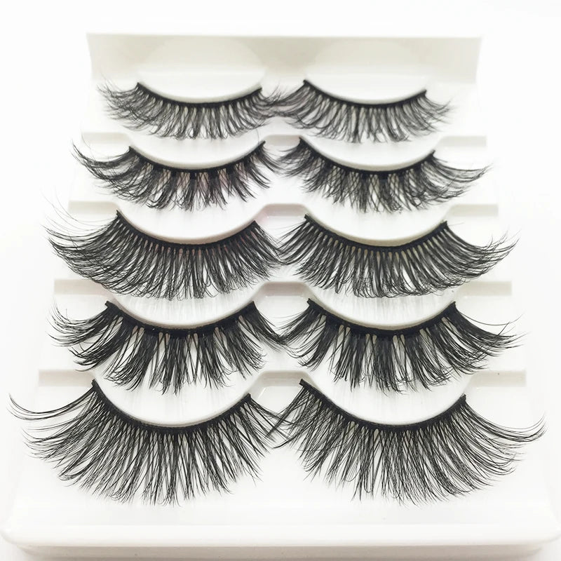 A set of handmade 3D mink false eyelashes displayed on a white tray.