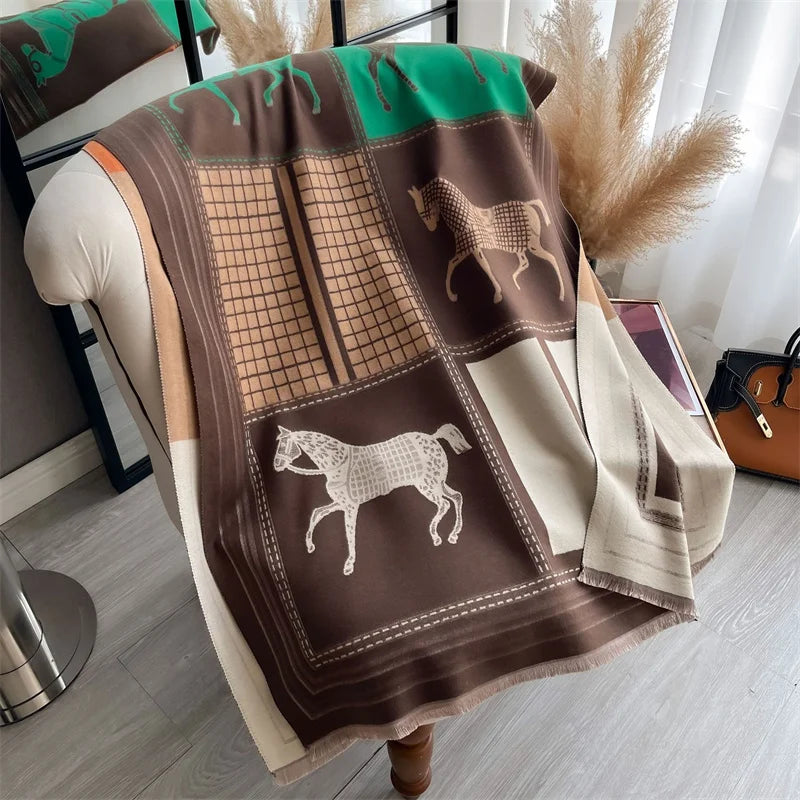 A brown and green plaid cashmere feel scarf draped over a light-colored garment.