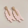 Pair of pink angel wing hair clips with gold-toned barrettes