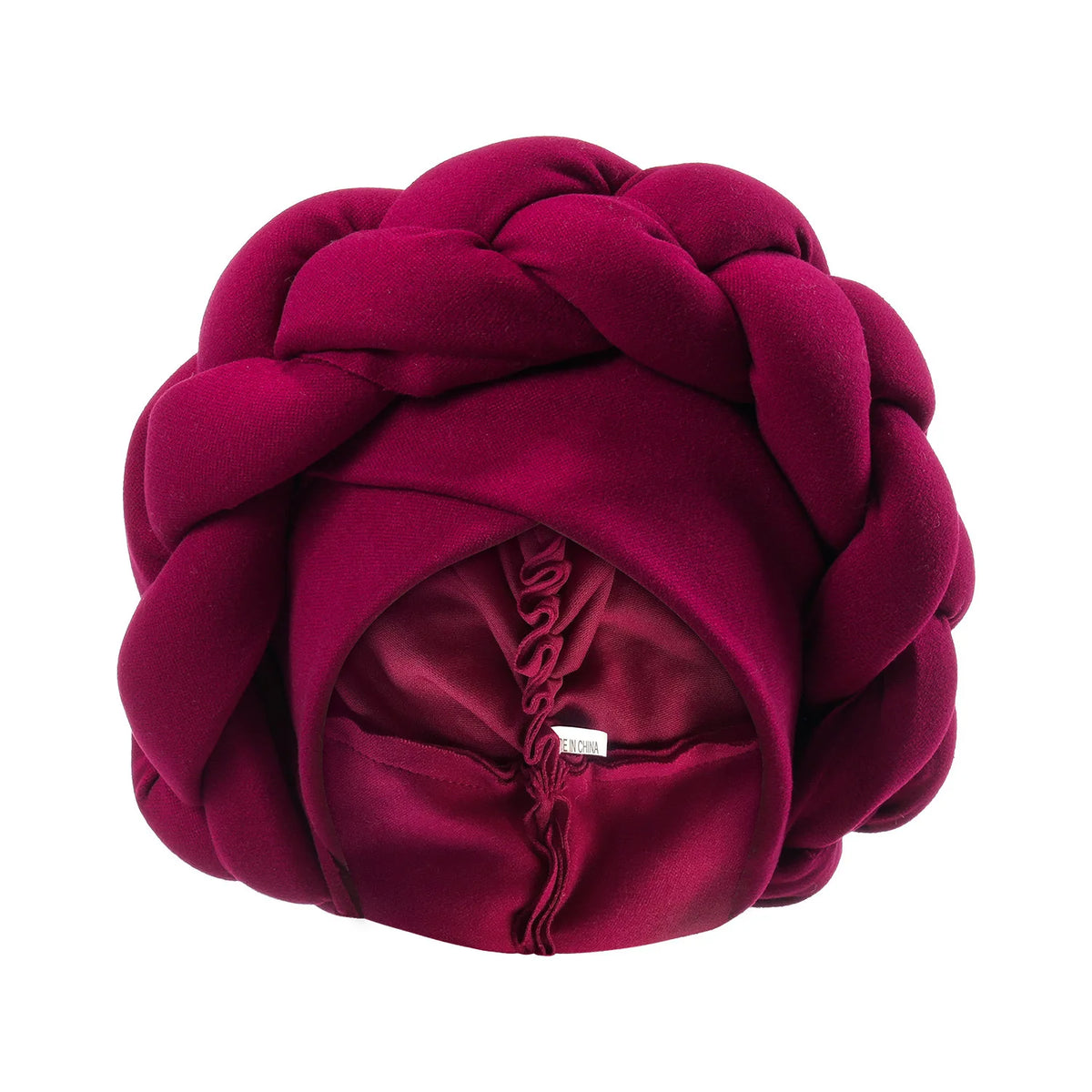 A deep magenta velvet braided turban cap for African party headwear.