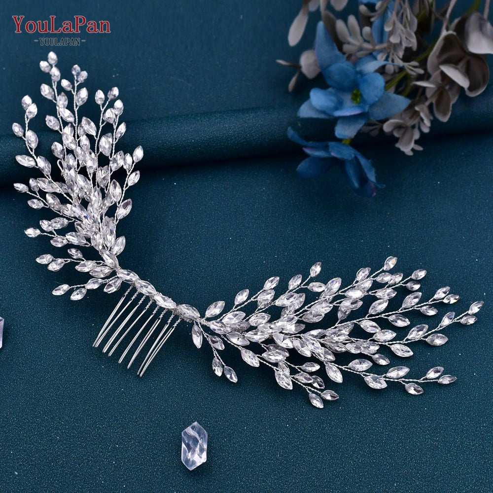 Silver rhinestone bridal headband or tiara with delicate leafy design on a dark teal background