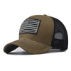 A brown tactical baseball cap featuring a black and white American flag design on the front panel.