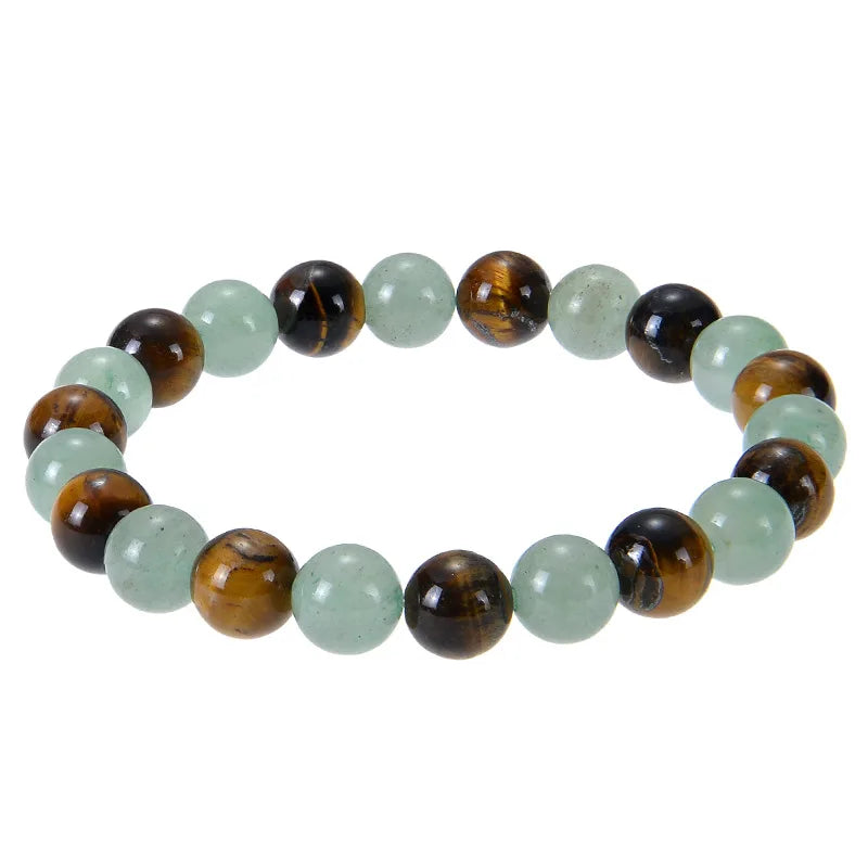A bracelet made of polished tiger eye crystals, featuring alternating brown and green beads.