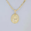 A gold-plated pendant necklace featuring a depiction of the Virgin Mary Christ.
