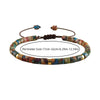 A bracelet made of colorful natural stone beads with wooden string and clasps.