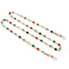 A delicate lanyard chain featuring various colored gemstone beads, including red, green, blue, and black, used for sunglasses