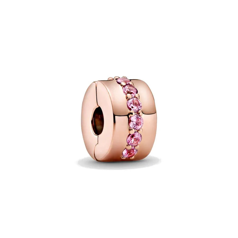 Rose gold charm pendant featuring a cluster of pink gemstones on a circular setting.