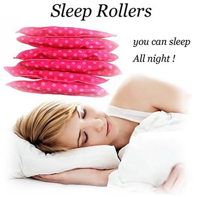 A woman is sleeping while using a set of pink sleep rollers for hair curling.