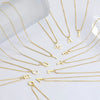 Gold initial letter necklaces in various fonts and styles displayed on a white background.