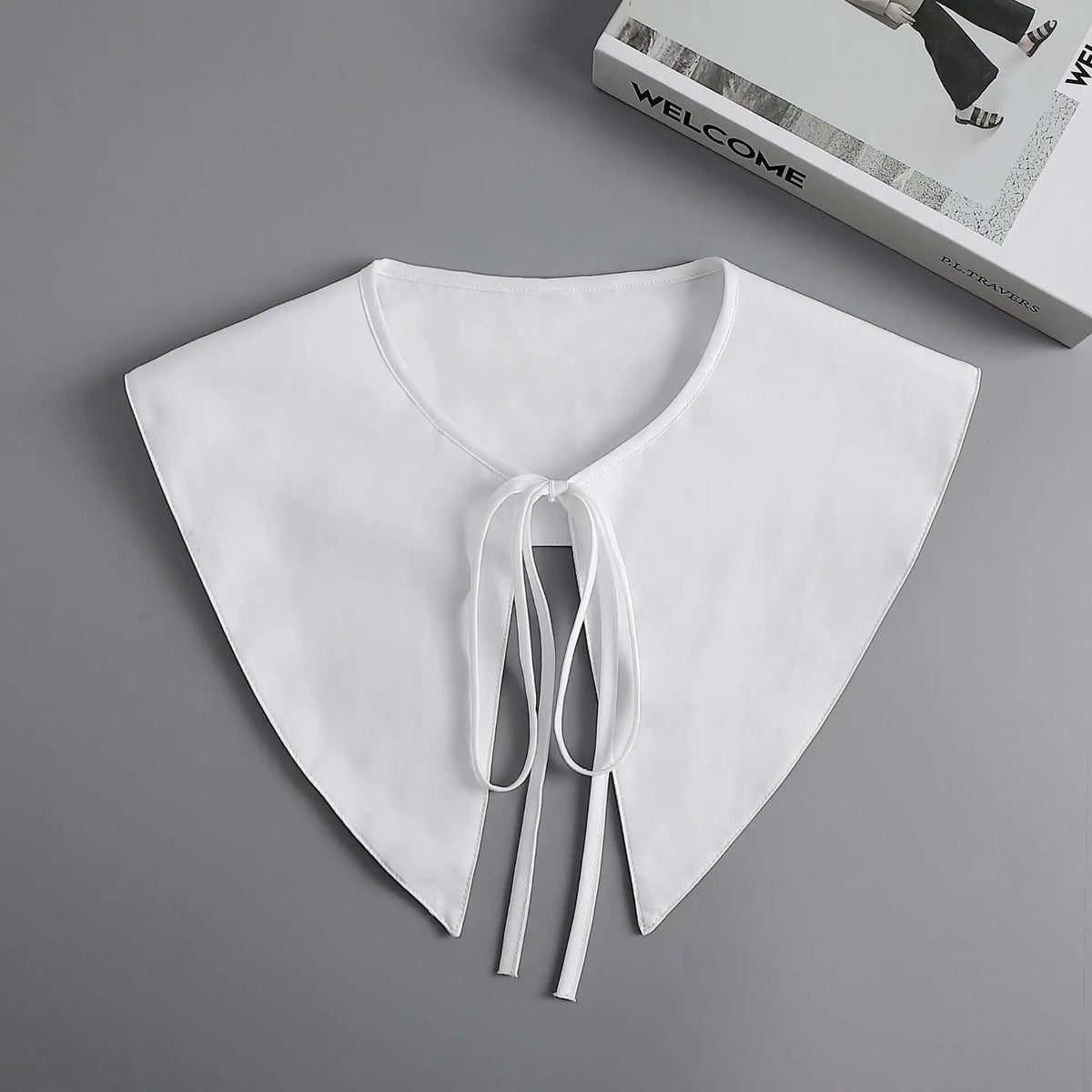 White fashion blouse with a false collar and detachable necktie detail