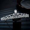 A sparkling cubic zirconia bridal tiara headband displayed on a black surface.