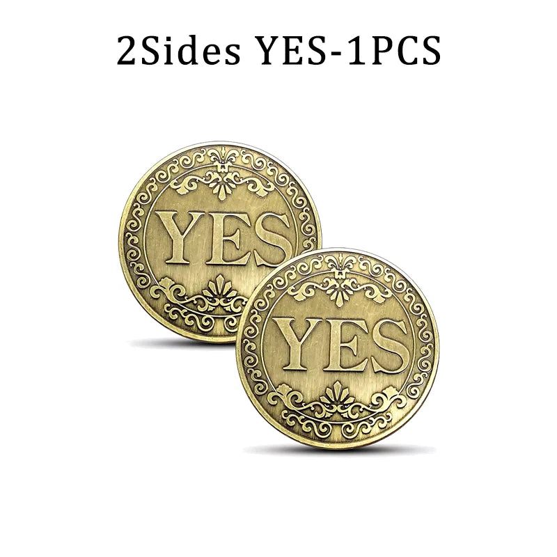 Two antique bronze decision coins stamped with the word YES