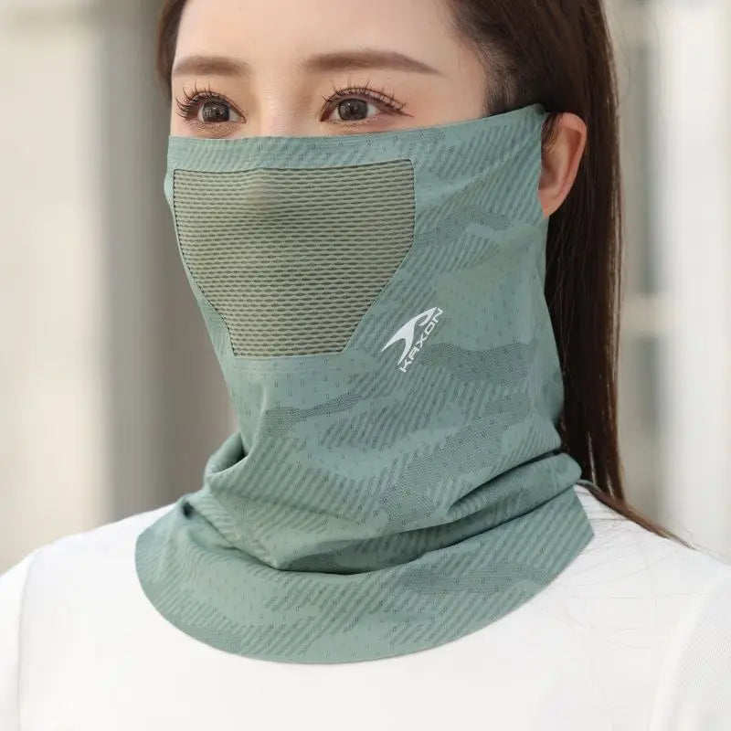 A woman wearing a light green ice silk breathable face and neck gaiter