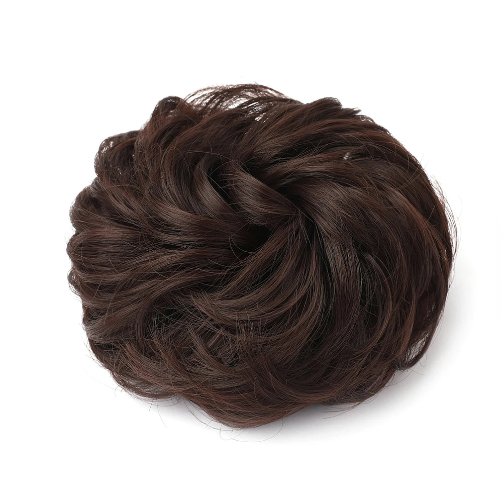 A dark brown, messy bun hairstyle made from hair pieces.