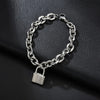 A silver charm lock bracelet made of 925 sterling silver chain and a padlock displayed on a dark surface.